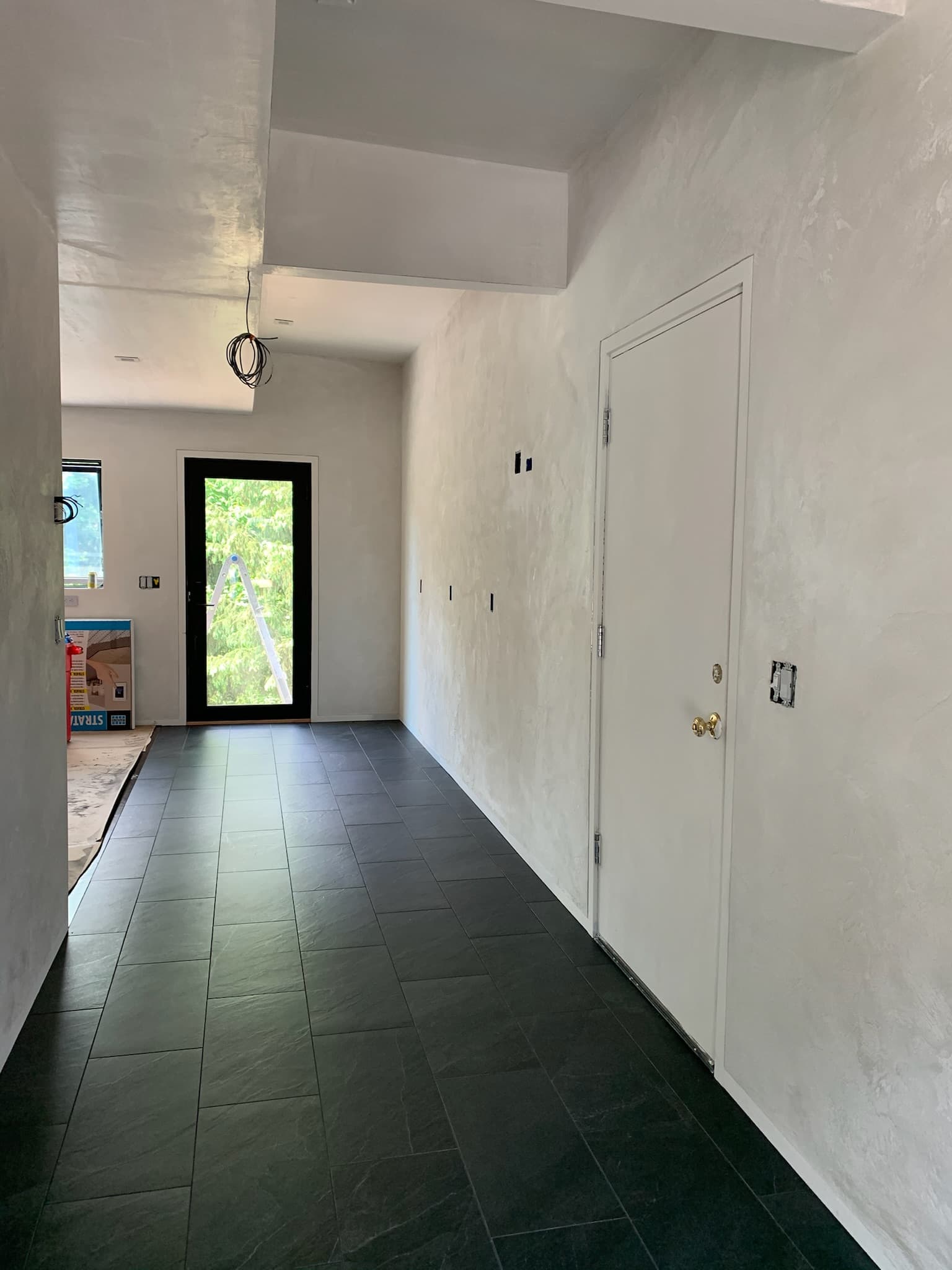 hallway with large slate tiles